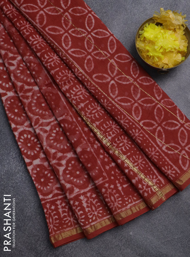 Chanderi bagru saree rustic orange and off white with allover dabu prints and small zari woven border