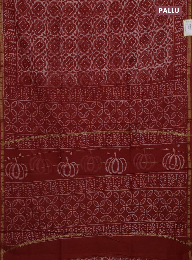 Chanderi bagru saree rustic orange and off white with allover dabu prints and small zari woven border
