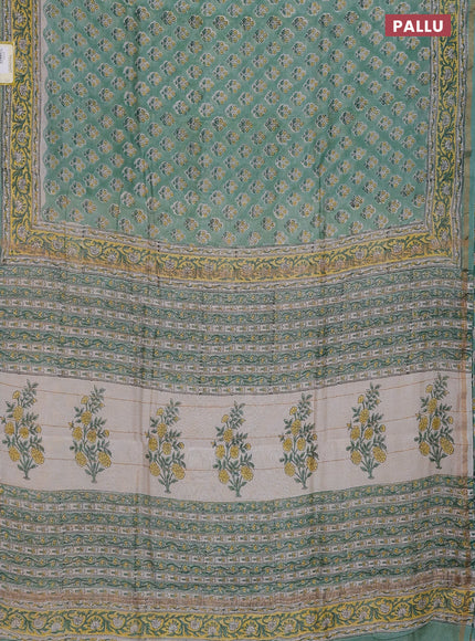 Chanderi bagru saree pastel green with allover floral butta prints and small zari woven border
