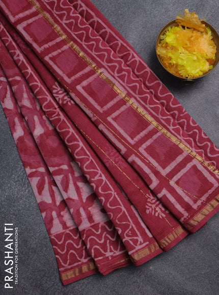 Chanderi bagru saree off white and maroon shade with allover batik prints and small zari woven border