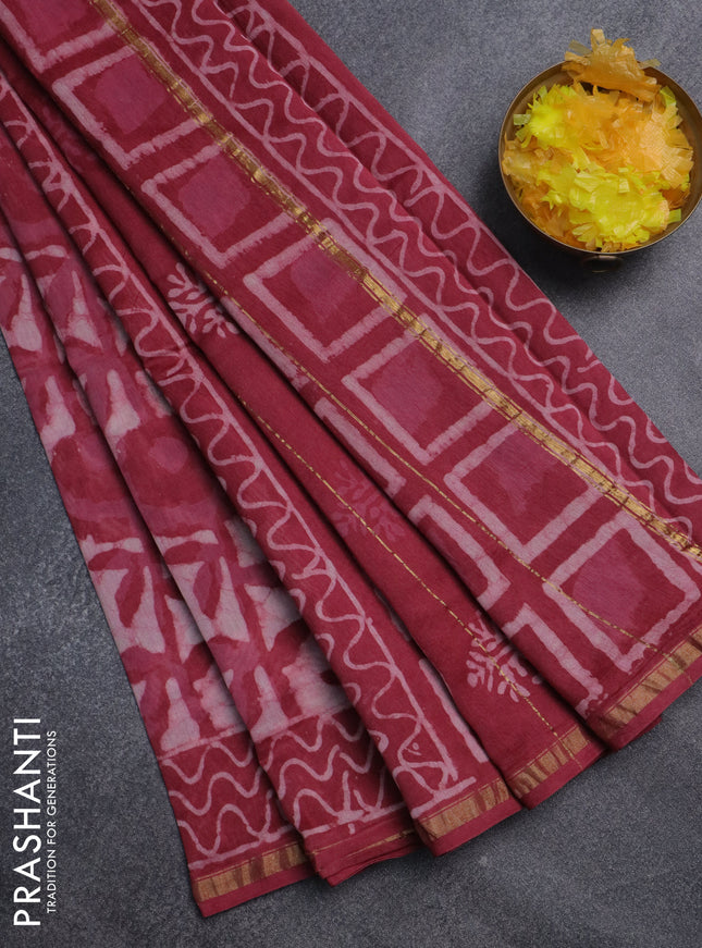 Chanderi bagru saree off white and maroon shade with allover batik prints and small zari woven border