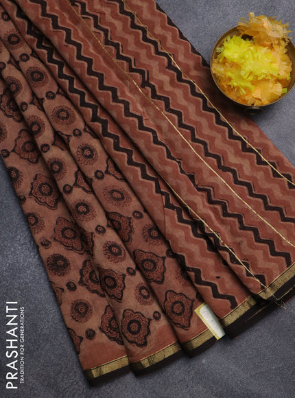 Chanderi bagru saree pastel brown and black with allover ajrakh prints and small zari woven border