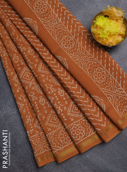 Chanderi bagru saree dark mustard with allover warli prints and small zari woven border