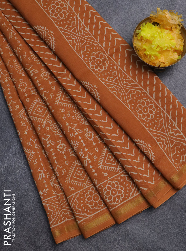 Chanderi bagru saree dark mustard with allover warli prints and small zari woven border