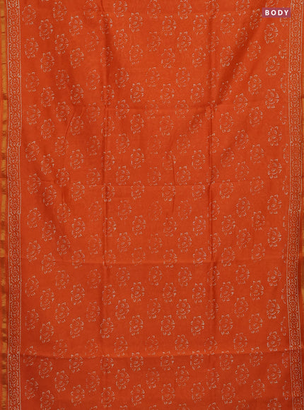 Chanderi bagru saree orange with allover dfloral butta prints and small zari woven border