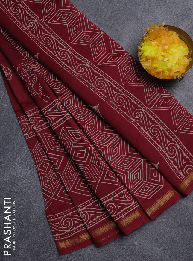 Chanderi bagru saree maroon with floral butta prints and small zari woven border