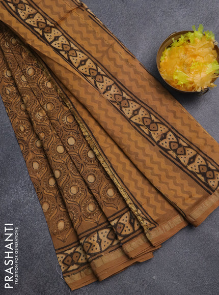 Chanderi bagru saree pastel brown and pale orange with allover prints and small zari woven border