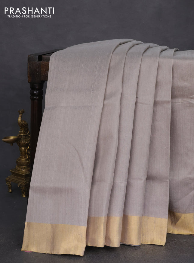 Pure raw silk saree grey and cs blue with plain body and ikat weaves pallu