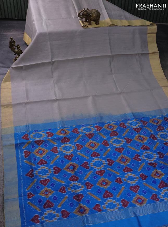 Pure raw silk saree grey and cs blue with plain body and ikat weaves pallu