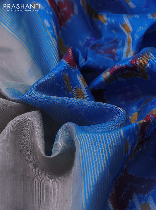 Pure raw silk saree grey and cs blue with plain body and ikat weaves pallu