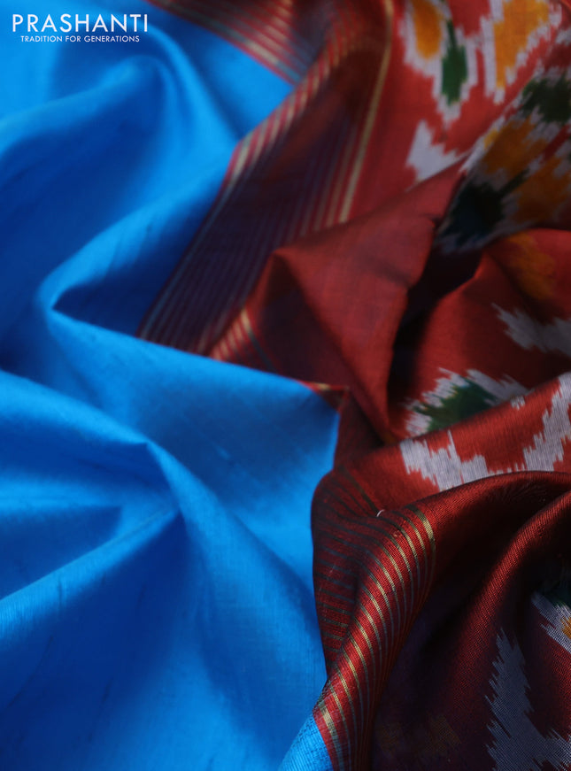 Pure raw silk saree blue and maroon with plain body and ikat weaves pallu