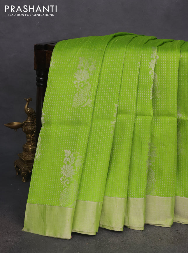 Pure raw silk saree light green and pink with allover silver zari weaves and zari woven border