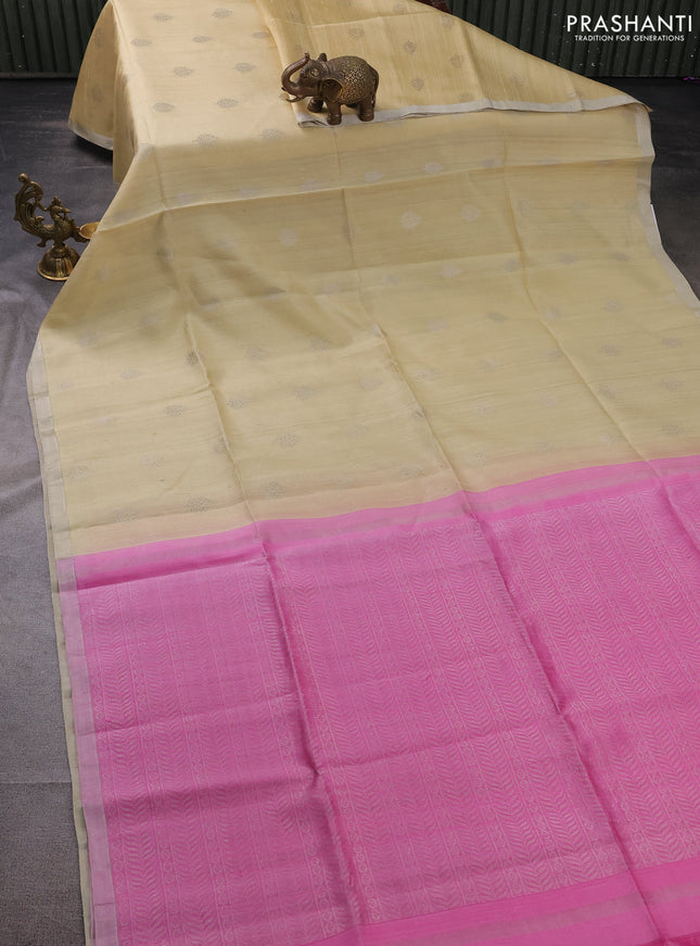 Pure raw silk saree sandal and light pink with silver zari woven buttas and silver zari woven border