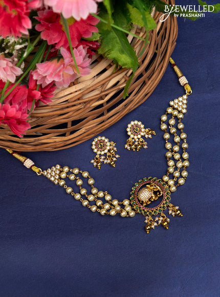 Pearl choker elephant pendant with kemp & cz stones and pearl & golden beads hanging