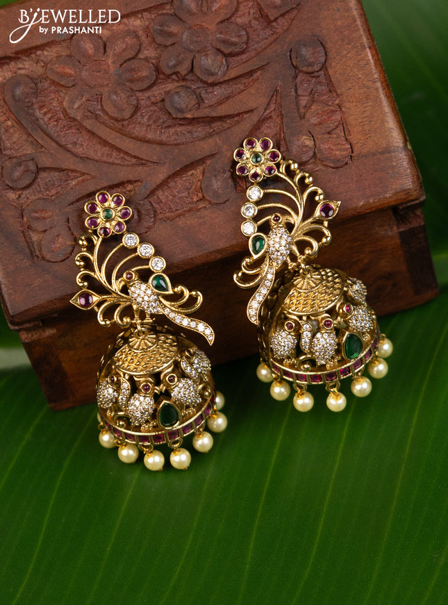 Antique jhumka peacock design with kemp & cz stones and pearl hangings