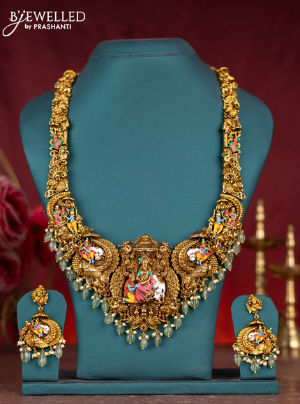 Antique enamel lakshmi pendant haram with kemp stones and green beads & pearl hanging