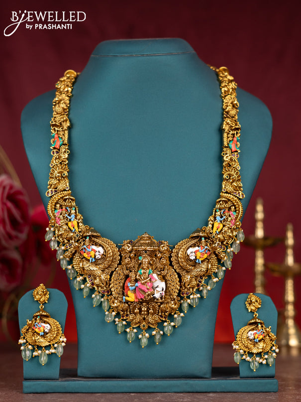 Antique enamel lakshmi pendant haram with kemp stones and green beads & pearl hanging