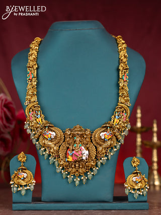 Antique enamel lakshmi pendant haram with kemp stones and green beads & pearl hanging