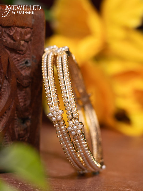 Pearl bangles with pearls in gold finish