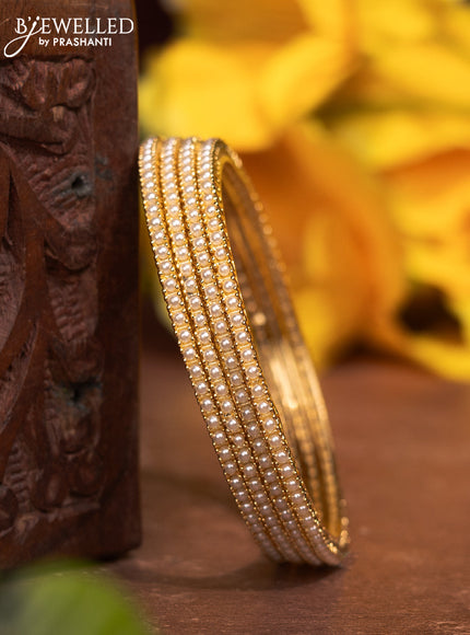 Pearl bangles with pearls in gold finish