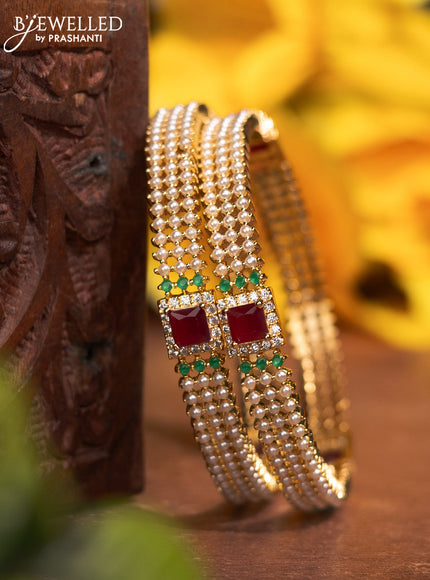 Pearl bangles with kemp & cz stones and pearls in gold finish