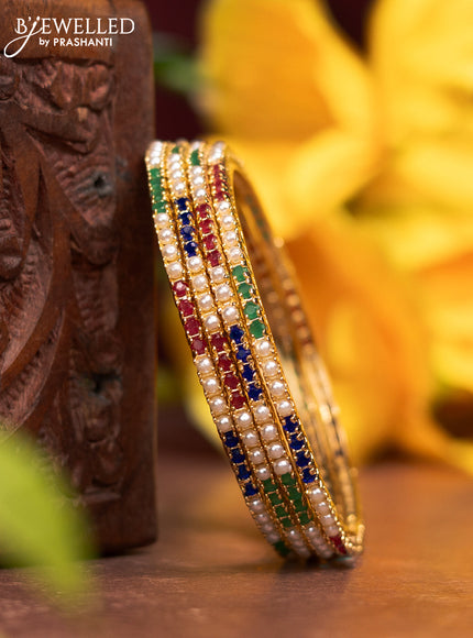 Pearl bangles with multicolour stones and pearls in gold finish