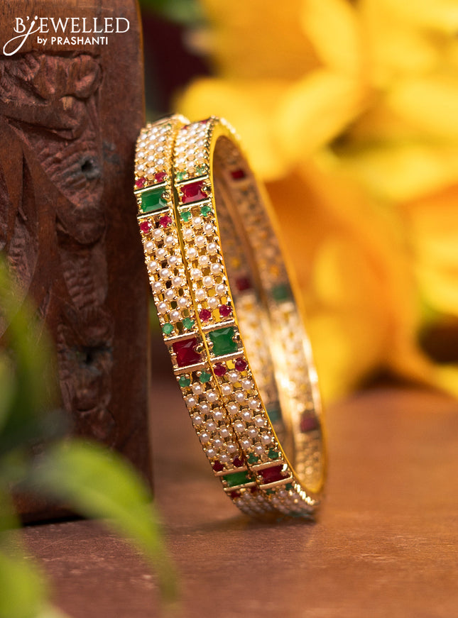 Pearl bangles with kemp stones and pearls in gold finish