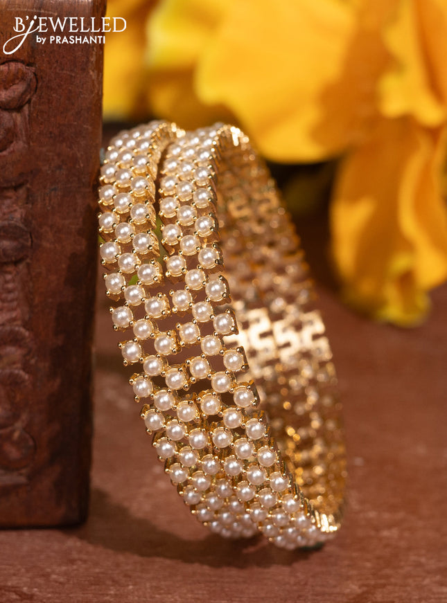 Pearl bangles with and pearls in gold finish