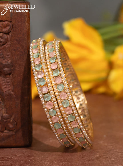 Pearl bangles with baby pink & mint green stones and pearls in gold finish
