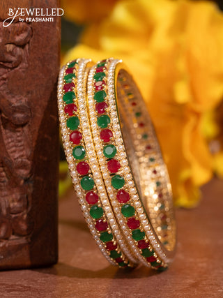 Pearl bangles with kemp stones and pearls in gold finish