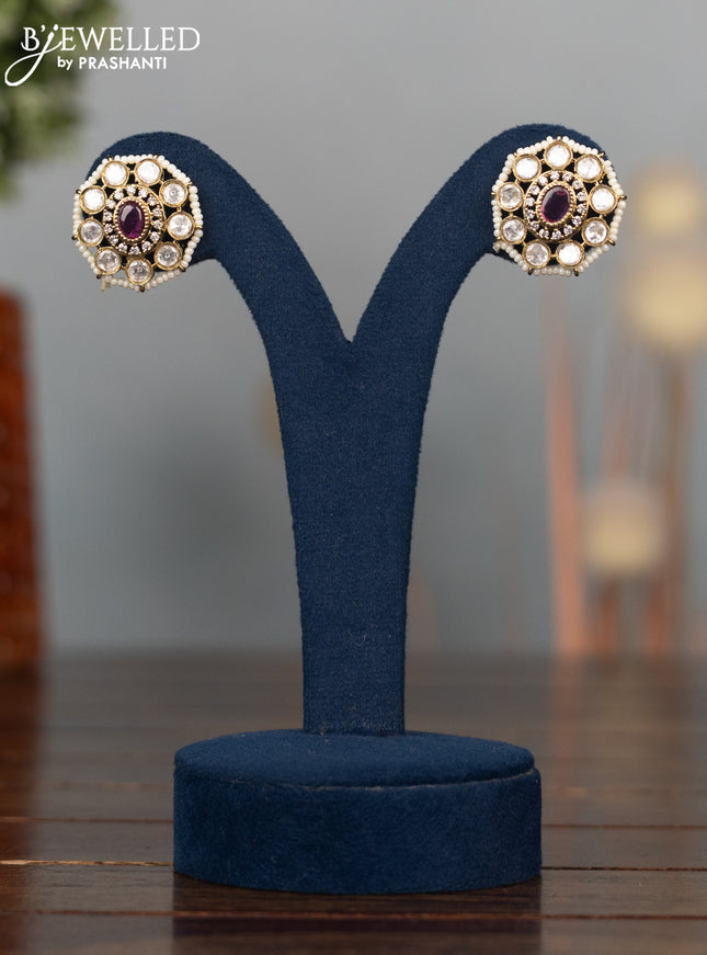 Antique earrings with ruby stones and pearl hangings