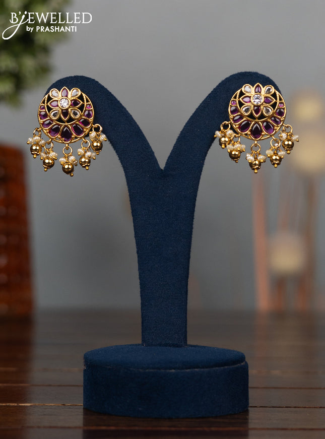 Antique earrings chandbali design with ruby & cz stones and pearl & golden beads hangings
