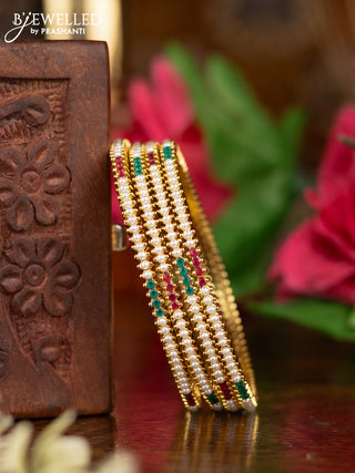 Pearl Bangles with kemp stones pearls in gold finish