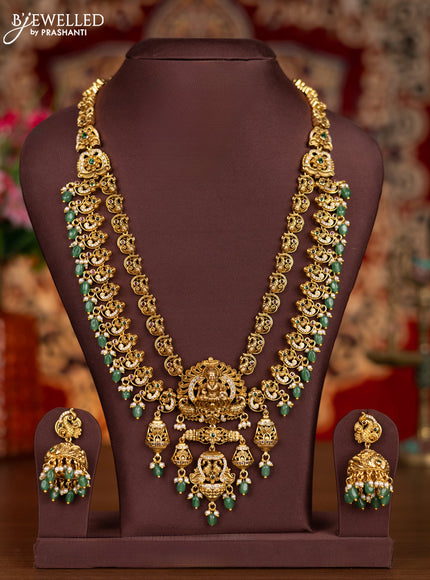 Antique double layer haram lakshmi pendant with kemp & cz stones and pearl & mint green beads hanginngs