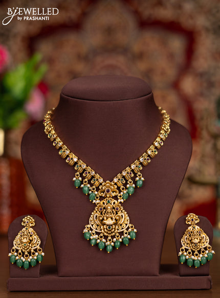 Antique necklace lakshmi pendant with kemp & cz stones and pearl & mint green beads hangings