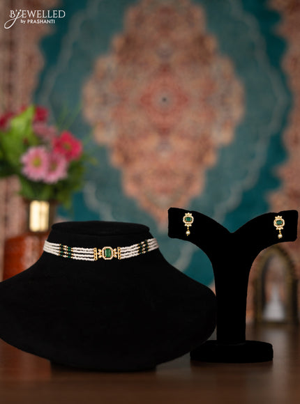 Pearl choker with emerald and cz stones
