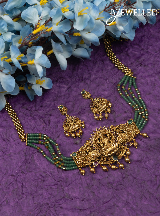 Antique green beaded choker lakshmi design with kemp stones and golden beads hangings