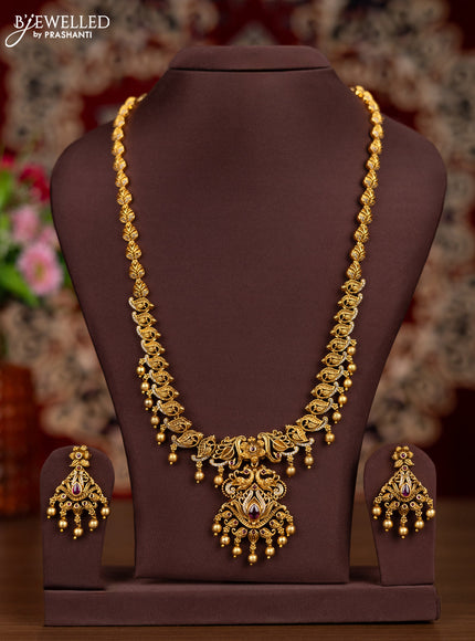 Antique haaram leaf design with pink kemp & cz stones and golden beads hangings