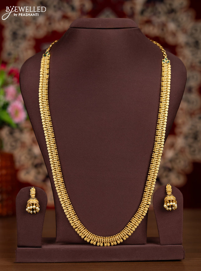 Antique haaram with simple design and emerald stones