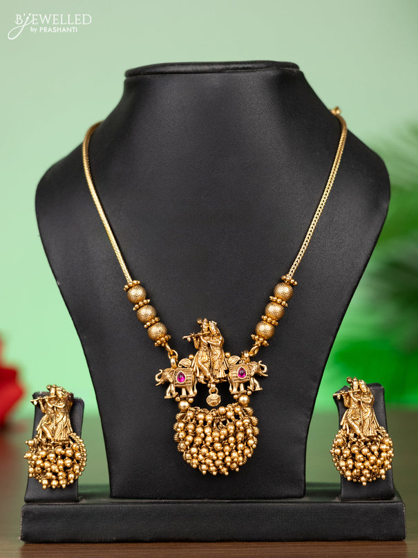 Antique attigai necklace radhai krishna pendant with pink kemp stones and golden beads hangings