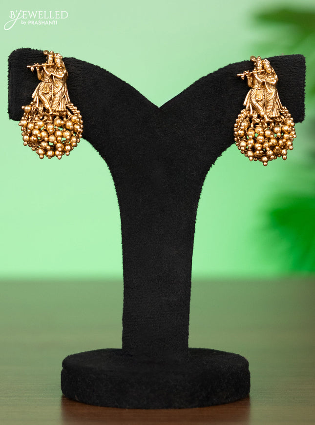 Antique attigai necklace radhai krishna pendant with pink kemp stones and golden beads hangings