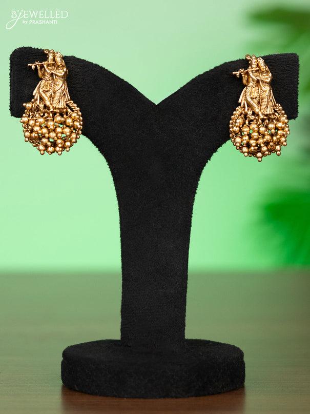 Antique attigai necklace radhai krishna pendant with pink kemp stones and golden beads hangings