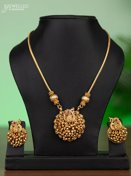 Antique attigai necklace peacock design with pink kemp stones and golden beads hangings