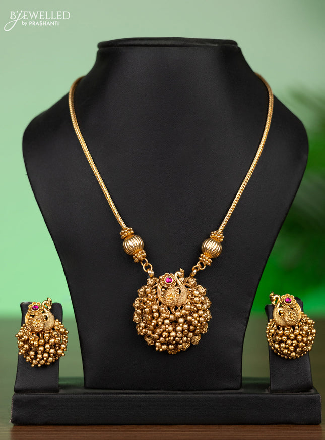 Antique attigai necklace peacock design with pink kemp stones and golden beads hangings