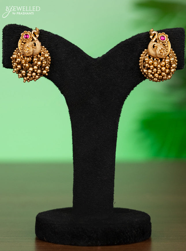 Antique attigai necklace peacock design with pink kemp stones and golden beads hangings