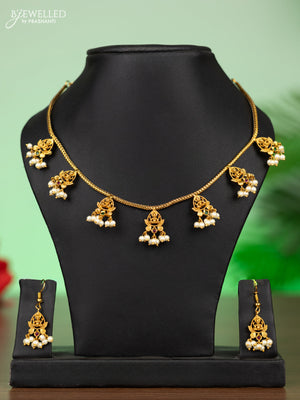Antique attigai necklace lakshmi design with kemp stones and pearl hangings