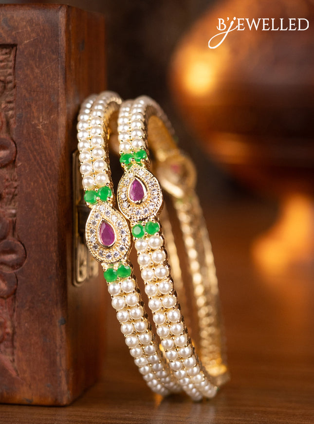 Pearl bangles with kemp & cz stones and pearls in gold finish