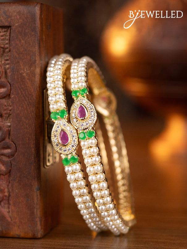 Pearl bangles with kemp & cz stones and pearls in gold finish