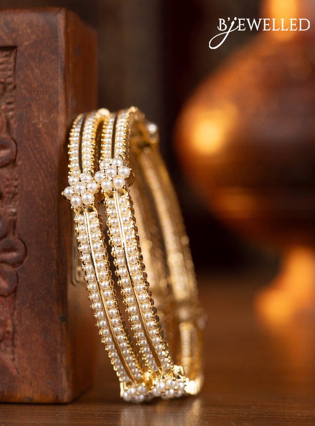 Pearl bangles with pearls in gold finish