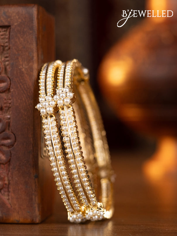 Pearl bangles with pearls in gold finish